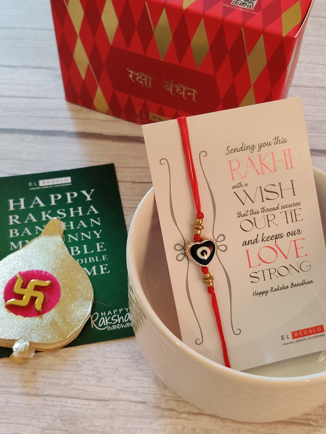 

EL REGALO Evil Eye Rakhi Combo for Bhaiya With Roli Chawal Shagun and Greeting Card, Red