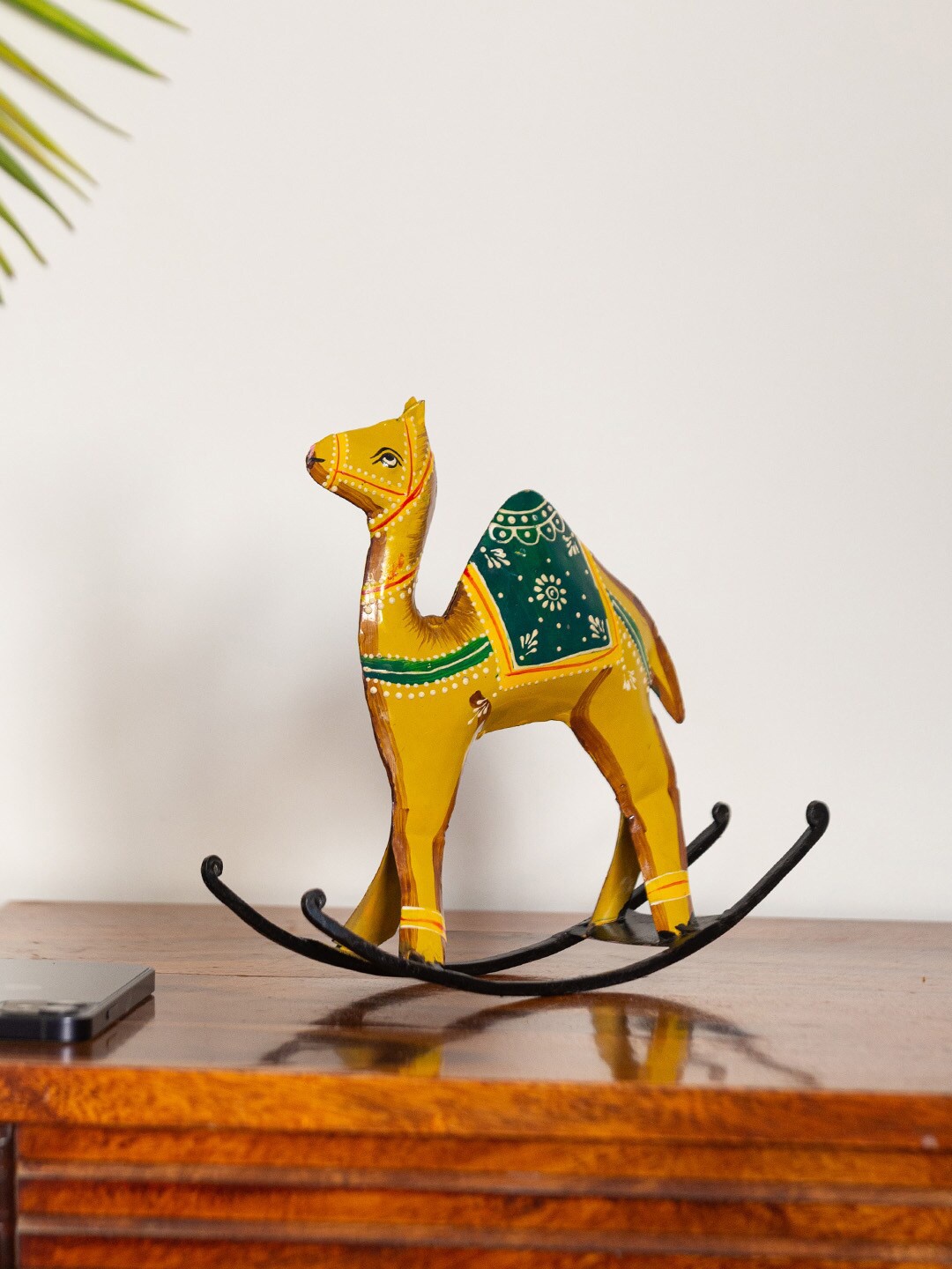 

ExclusiveLane Yellow & Green Rocking Camel Handpainted Showpiece
