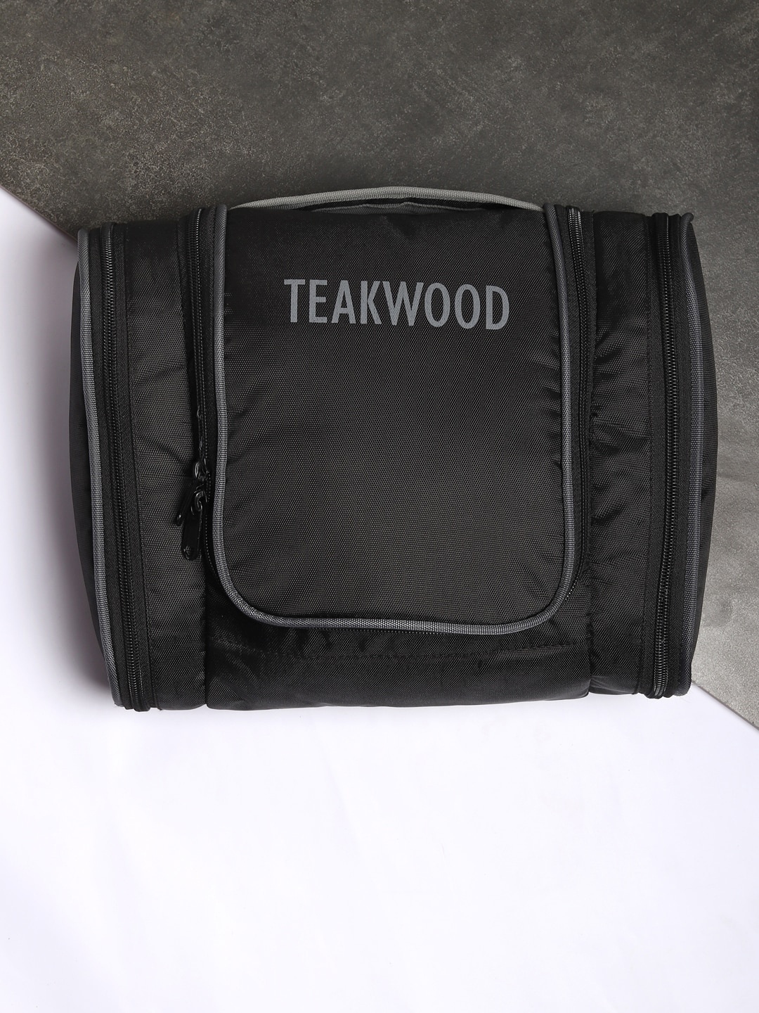 

Teakwood Leathers Black Brand Name Printed Toiletry Pouch
