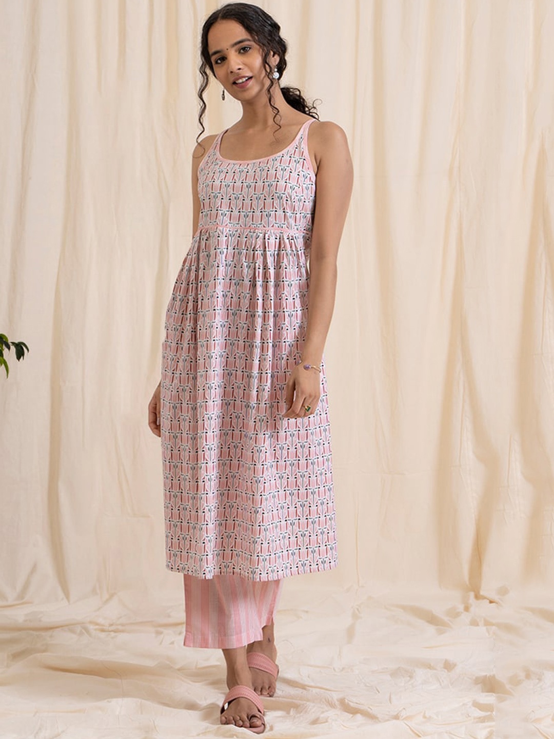

Women Pink Empire Pure Cotton Kurta with Trousers