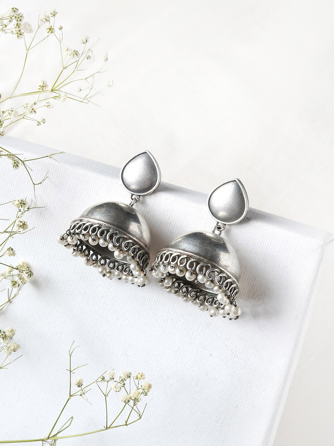 

TEEJH Silver-Toned Contemporary Jhumkas Earrings