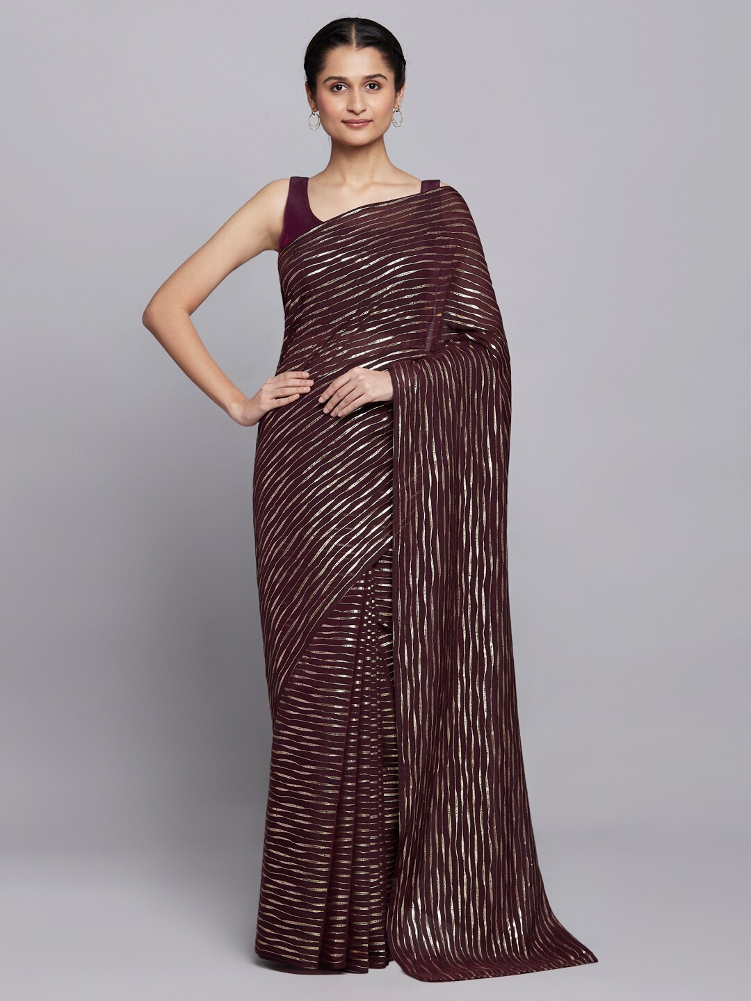 

navyasa Brown & Gold-Toned Striped Saree