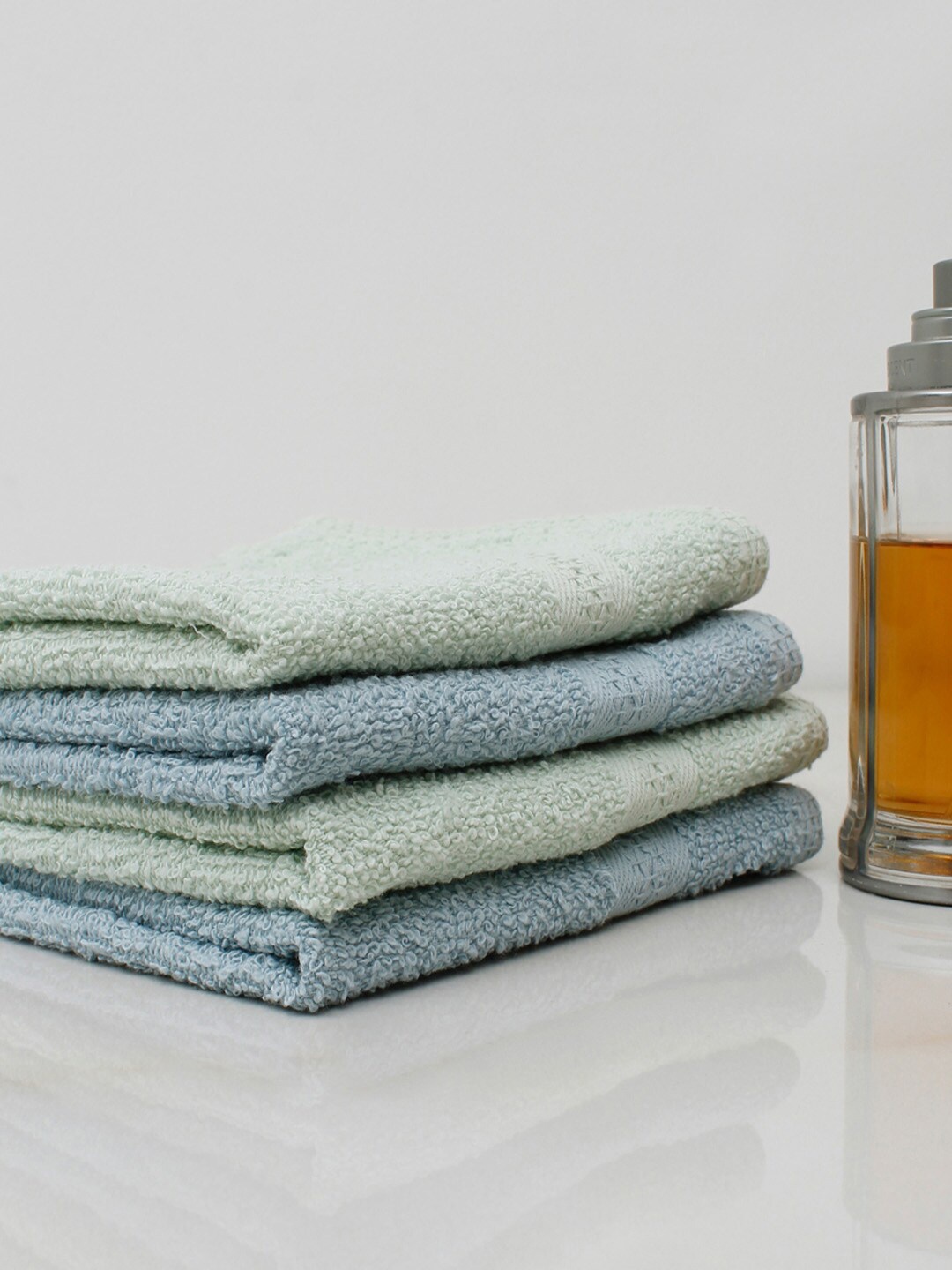 

AVI Living Pack of 4 Green & Blue Solid Cotton Face Towels