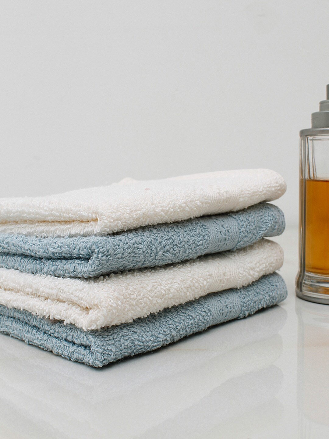

AVI Living Set Of 4 Cream & Blue Solid 450 GSM Pure Cotton Face Towels