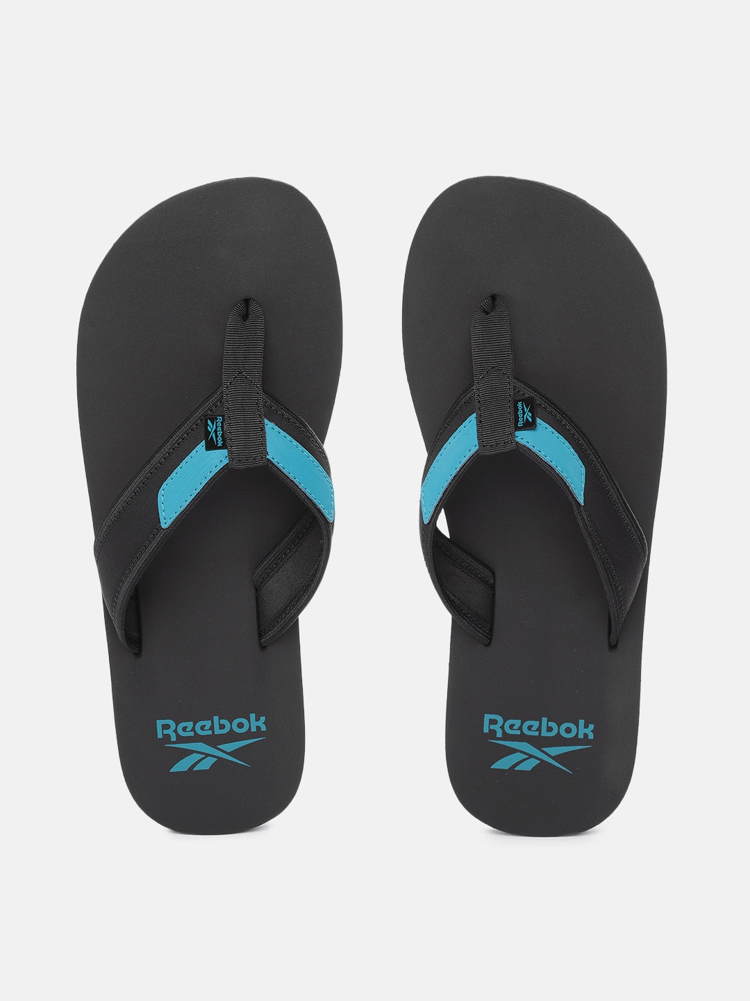 

Reebok Men Black & Turquoise Blue Colourblocked Thong Drift Flip-Flops