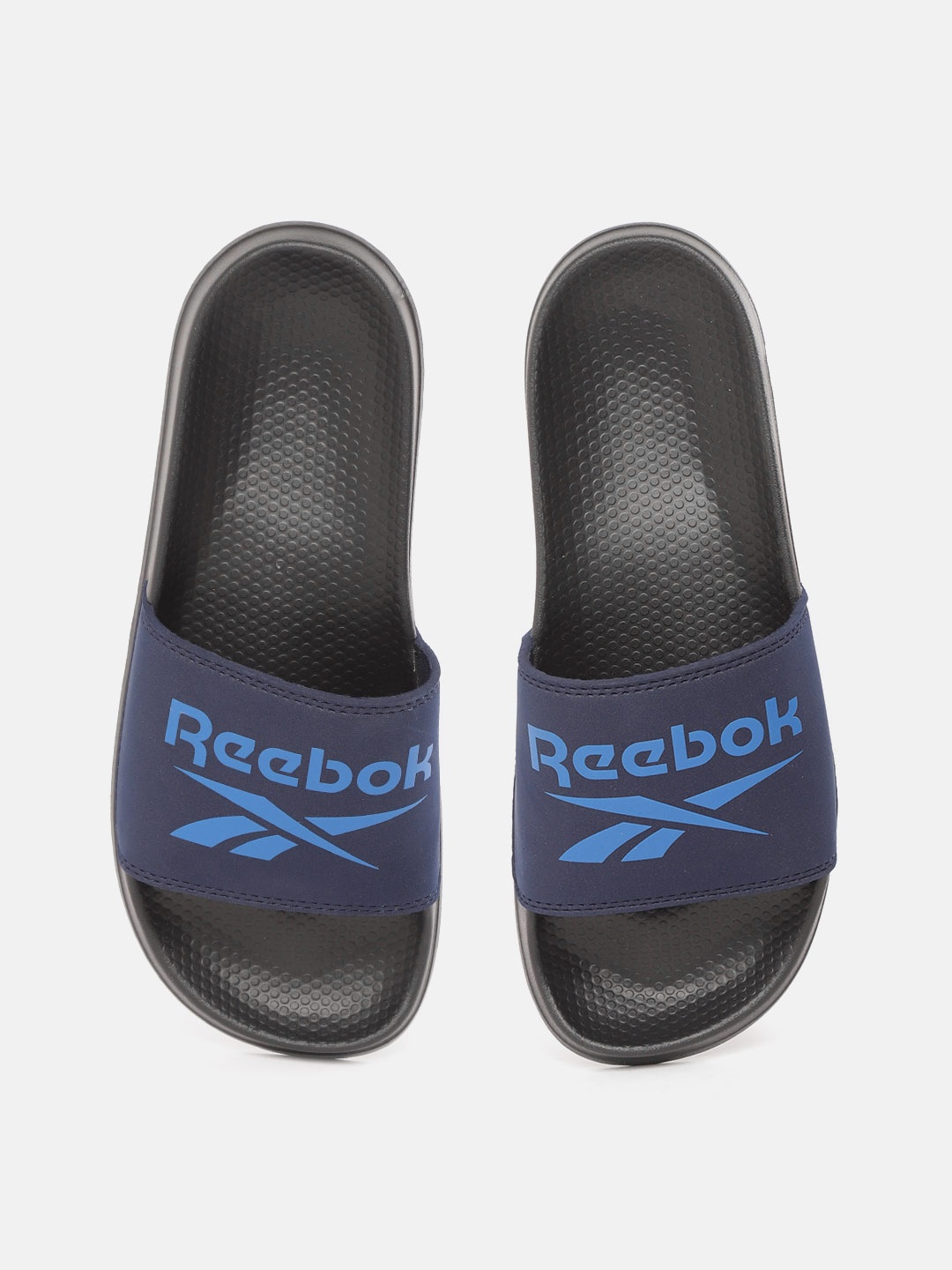 

Reebok Men Navy Blue Brand Logo Printed Sliders