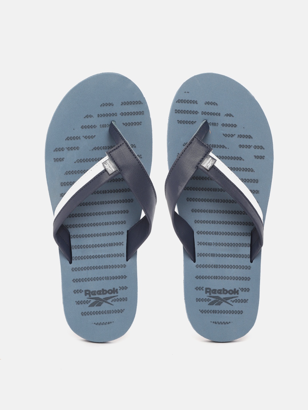 

Reebok Men Navy Blue & White Striped Thong Flip-Flops