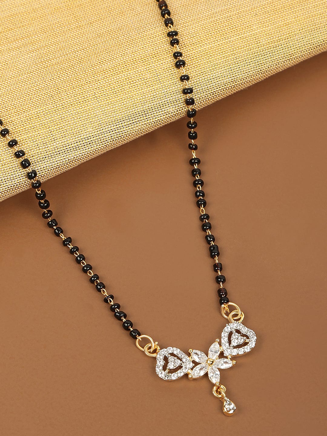 

AccessHer Gold-Plated White Stone-Studded & Black Beaded Mangalsutra