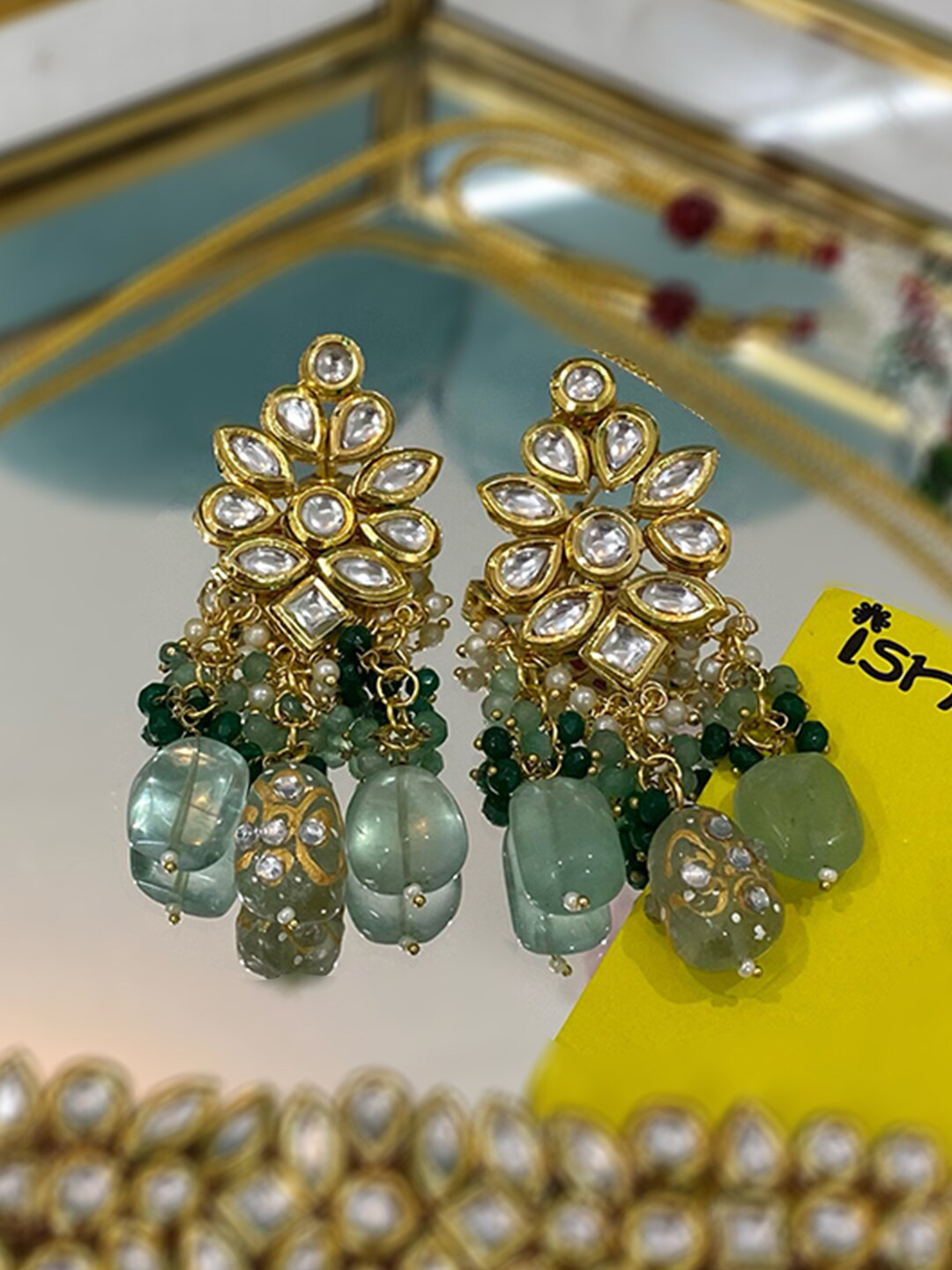 

Ishhaara Green Leaf Shaped Jhumkas Earrings