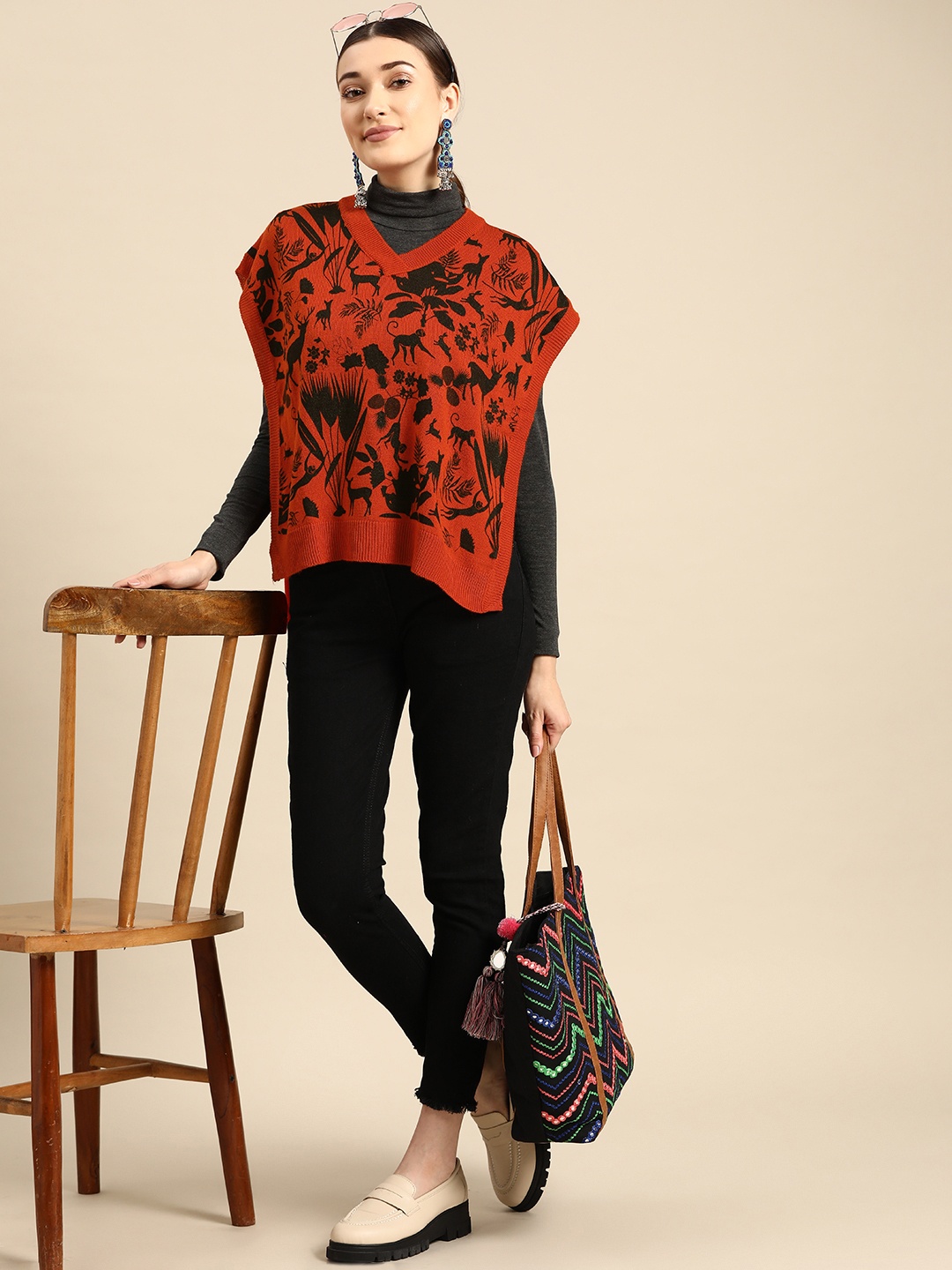 

Sangria Women Rust Orange & Black Printed Acrylic Poncho