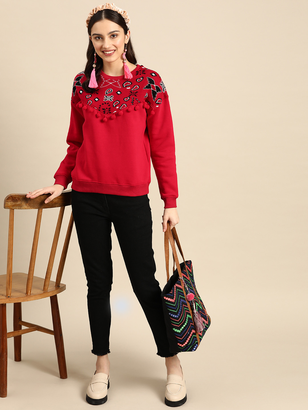 

Sangria Women Red & Black Geometric Sweatshirt
