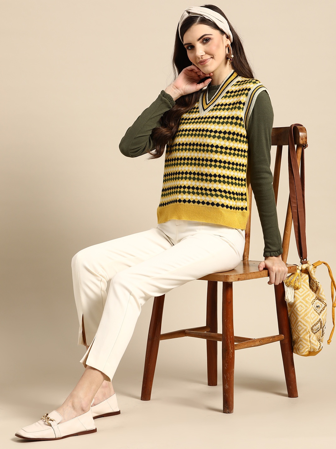 

Sangria Women Yellow & Black Printed Sweater Vest