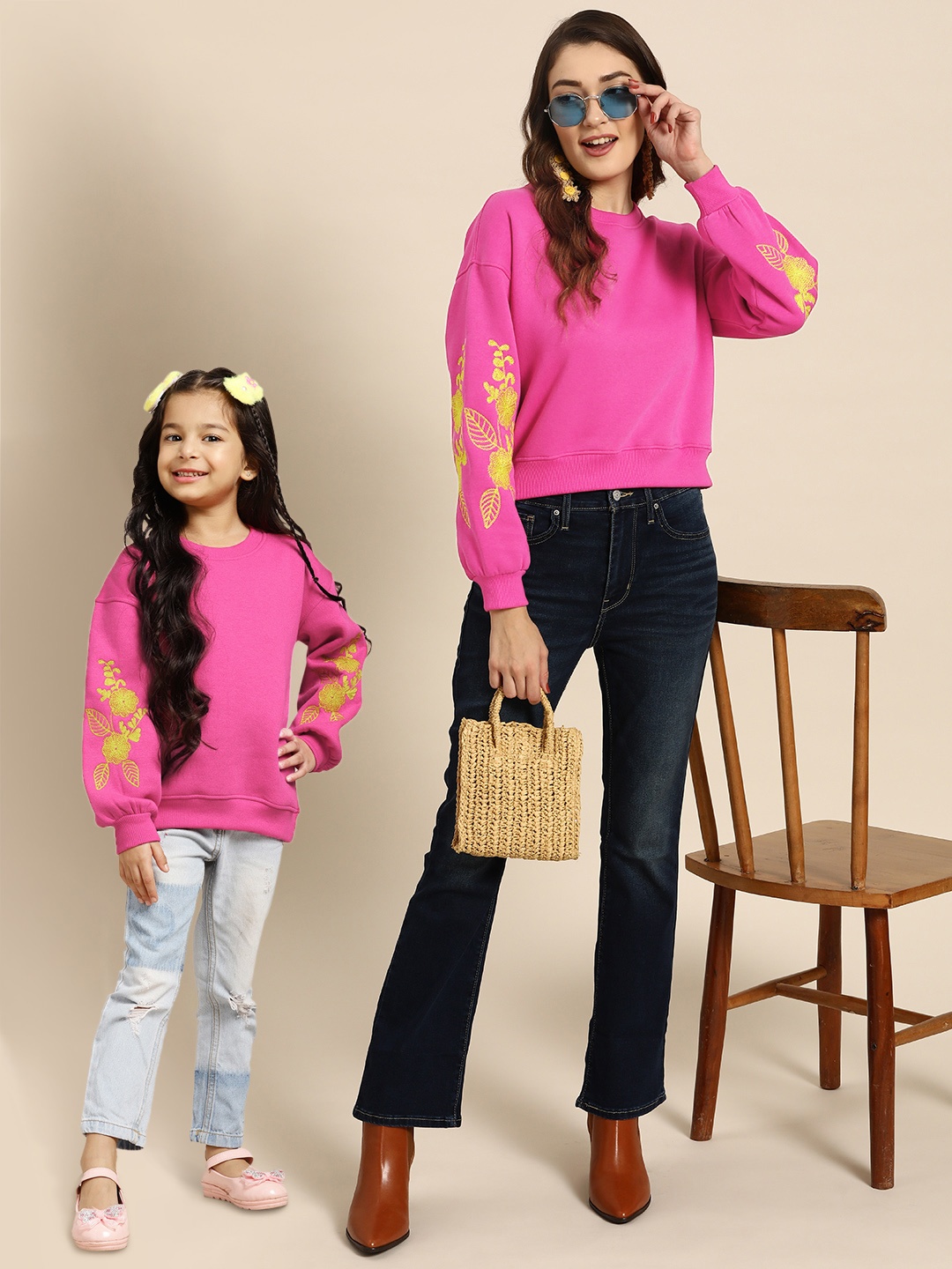 

Sangria Girls Pink & Yellow Solid Round Neck Sweatshirt with Embroidered Sleeves