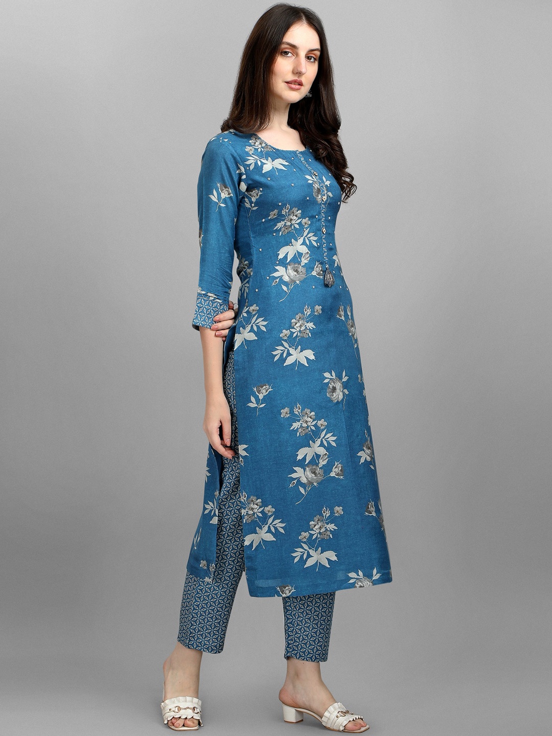 

Seerat Women Turquoise Blue Floral Silk Crepe Kurta with Palazzos