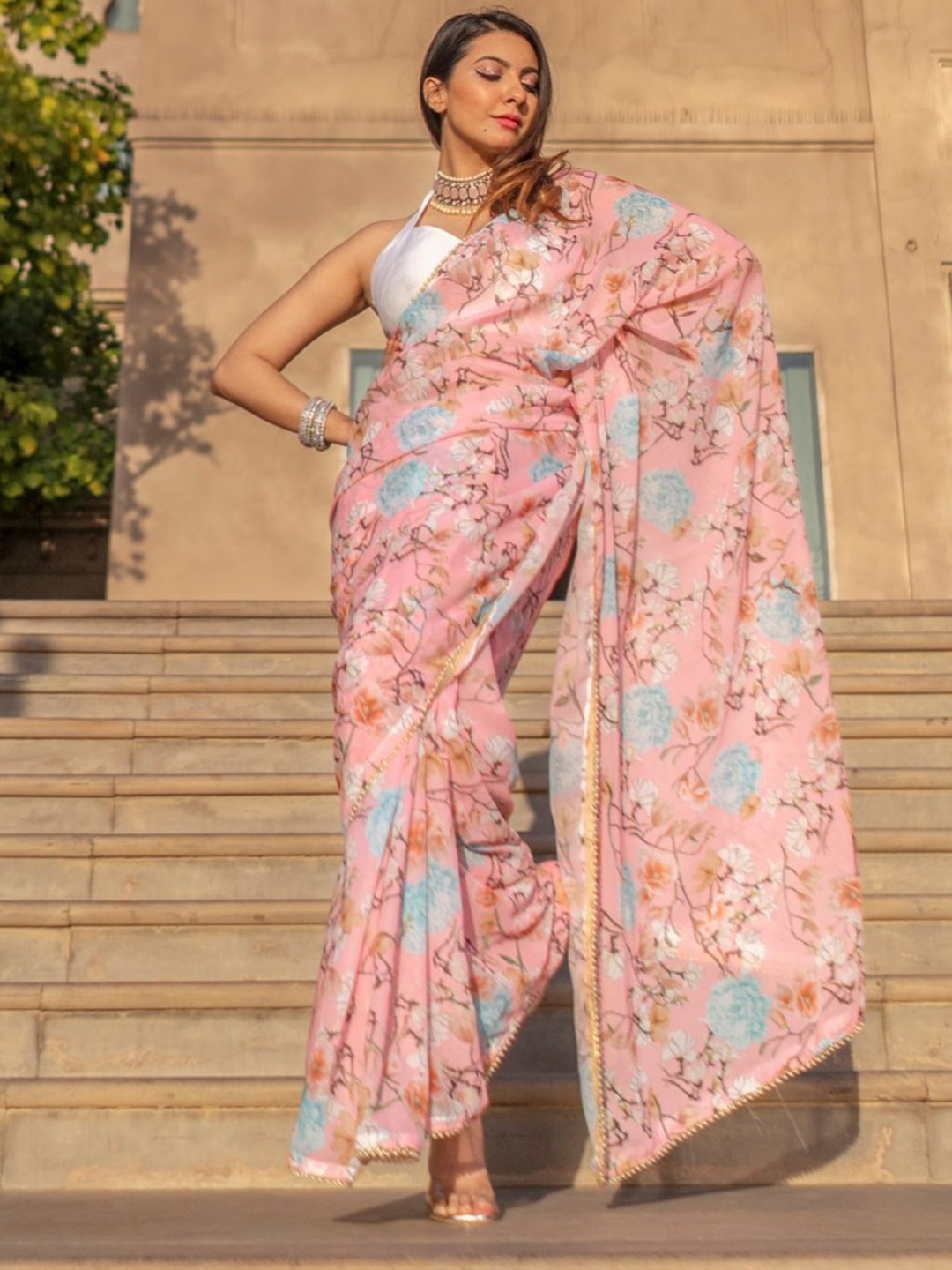 

Lavanya The Label Peach-Coloured & Blue Floral Saree