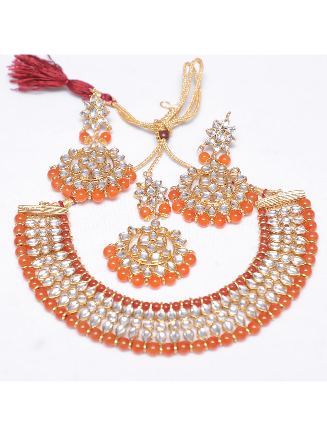 

Swarajshop Gold-Plated Orange & White Kundan-Studded Jewellery Set