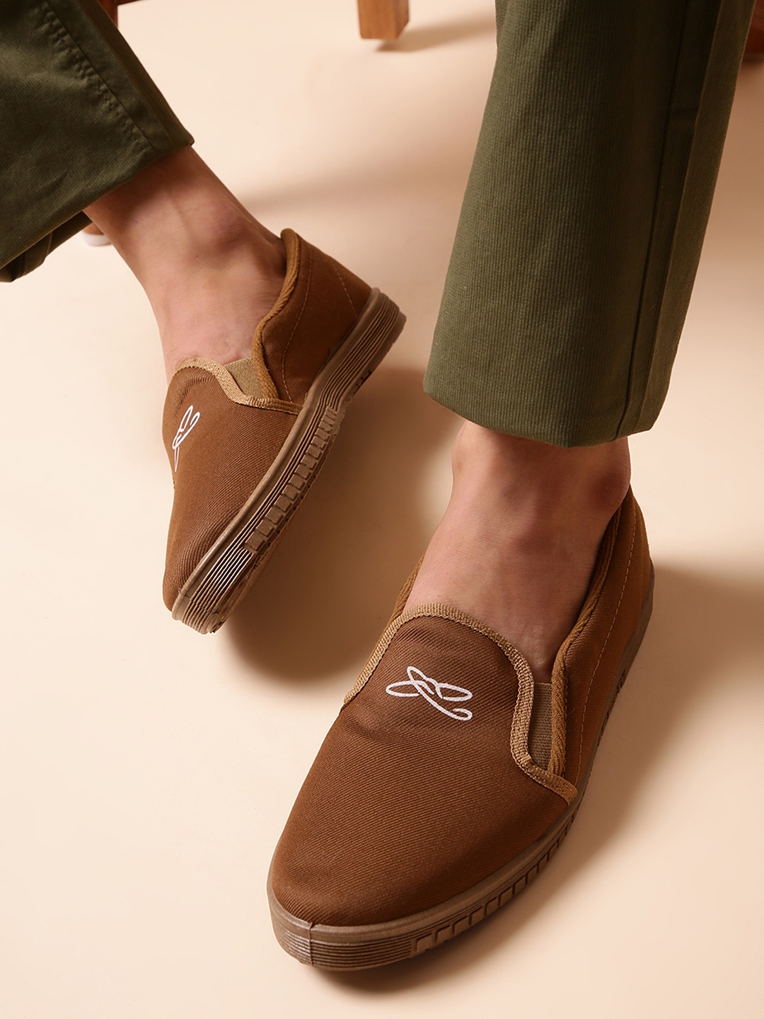 

Liberty Men Beige Solid Slip-On Sneakers