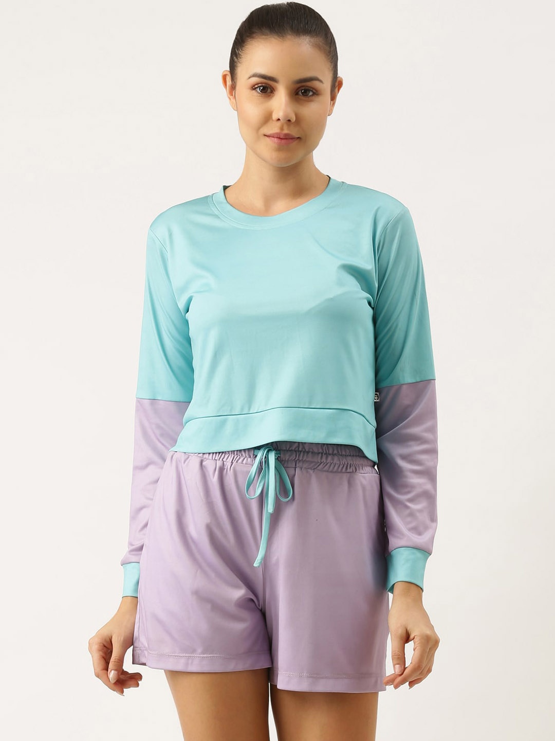 

Bannos Swagger Women Turquoise Blue & Lavender Colourblocked T-shirt & Shorts Set