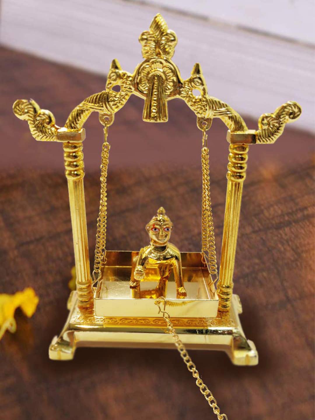 

Craftvatika Gold Toned Aluminium Swing Jhula With Ladoo Gopal