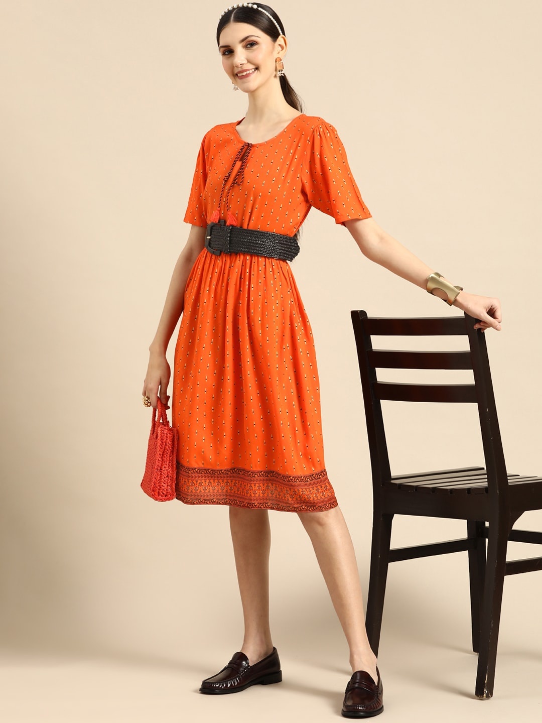 

Sangria Women Orange & Golden Ethnic Motif Printed A-Line Dress