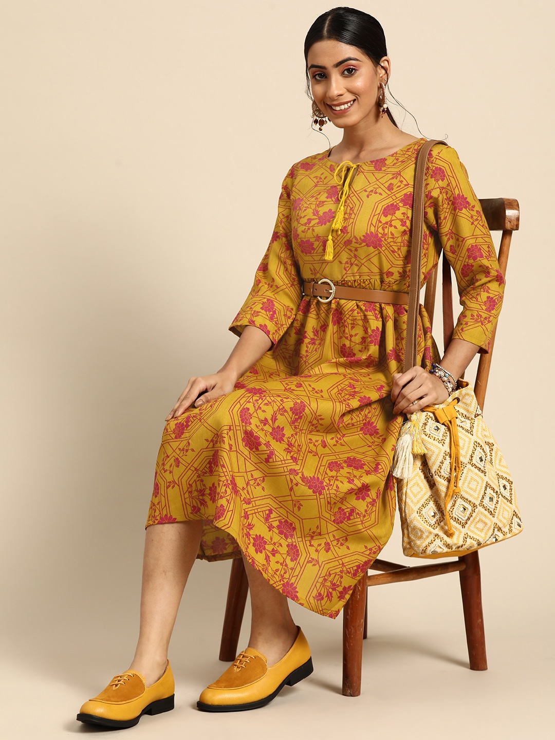 

Sangria Women Mustard Yellow & Pink Printed Tie-Up Neck A-Line Ethnic Dress