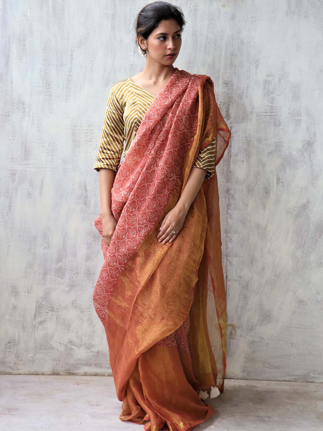 

Chidiyaa Rust & Gold-Toned Floral Zari Pure Linen Saree
