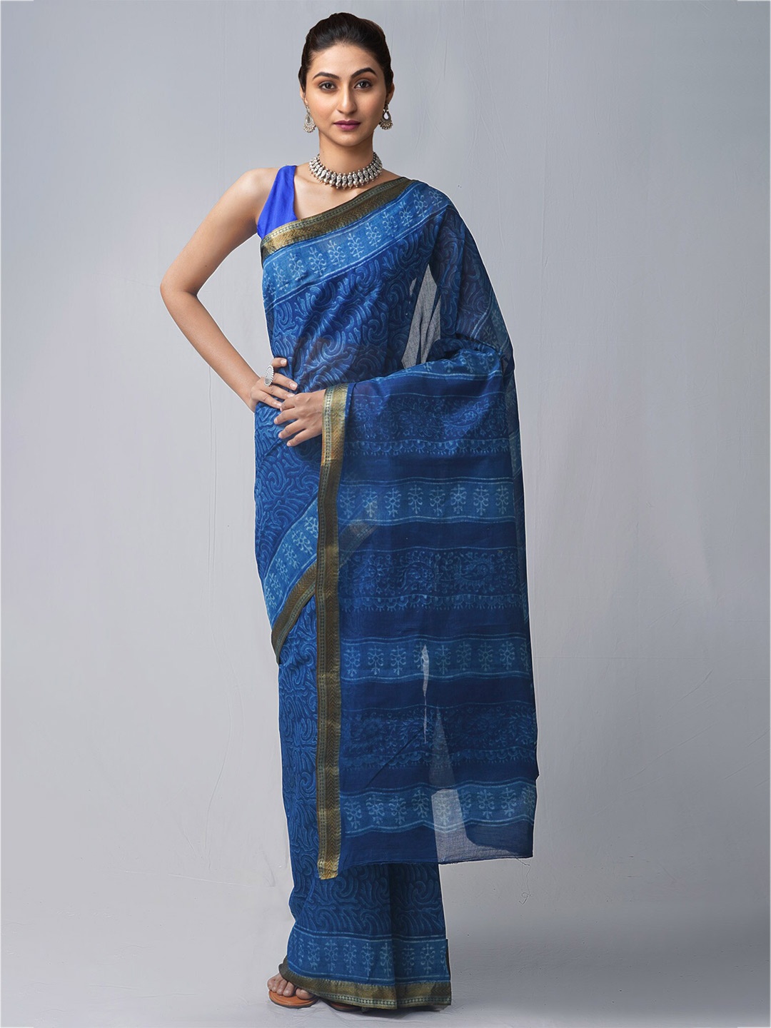 

Unnati Silks Navy Blue Floral Pure Cotton Dabu Saree
