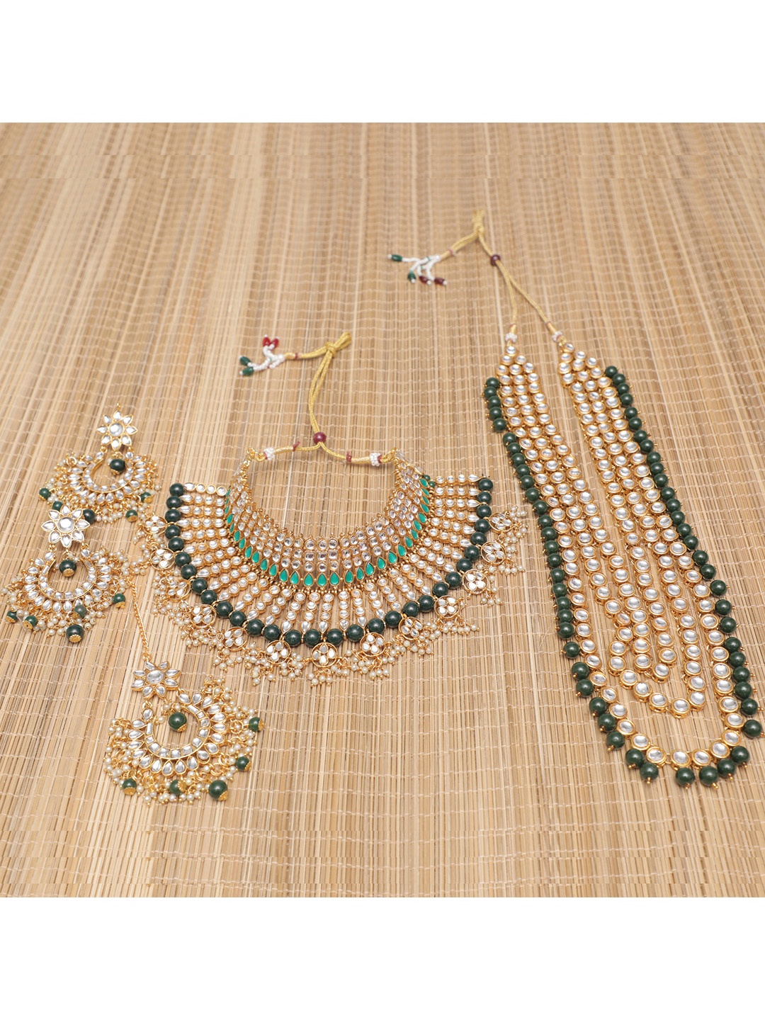 

Swarajshop Gold-Plated Green & White Kundan Studded & Beaded Jewellery Set