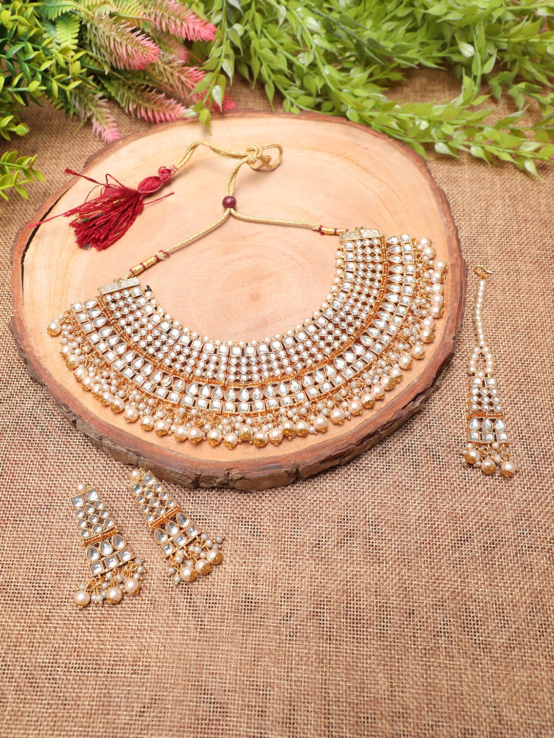 

Swarajshop Gold-Plated White Kundan Studded Jewellery Set