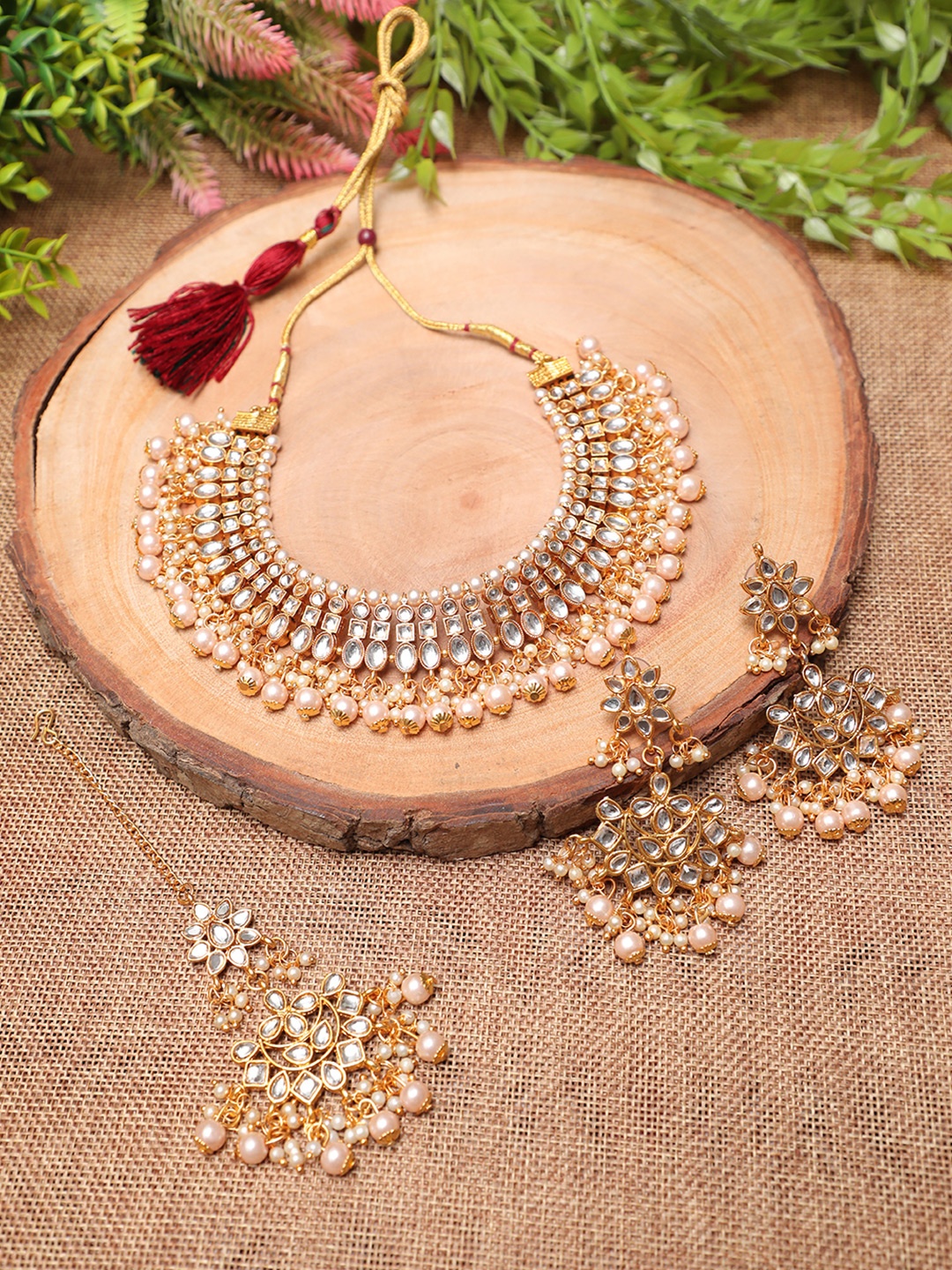 

Swarajshop Gold-Plated White Kundan-Studded & Pearl Beaded Jewellery Set