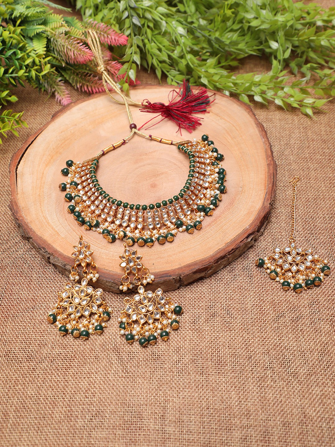 

Swarajshop Gold-Plated & White Kundan-Studded & Beaded Jewellery Set