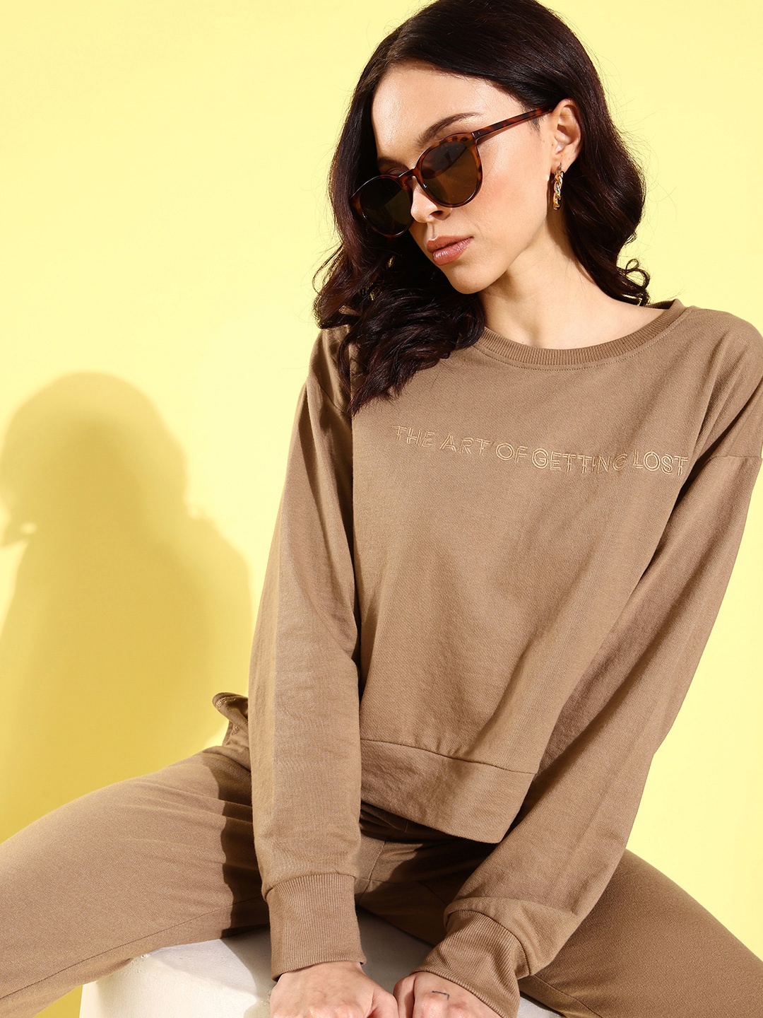 

Roadster Women Beige Solid Sweatshirt & Joggers Set