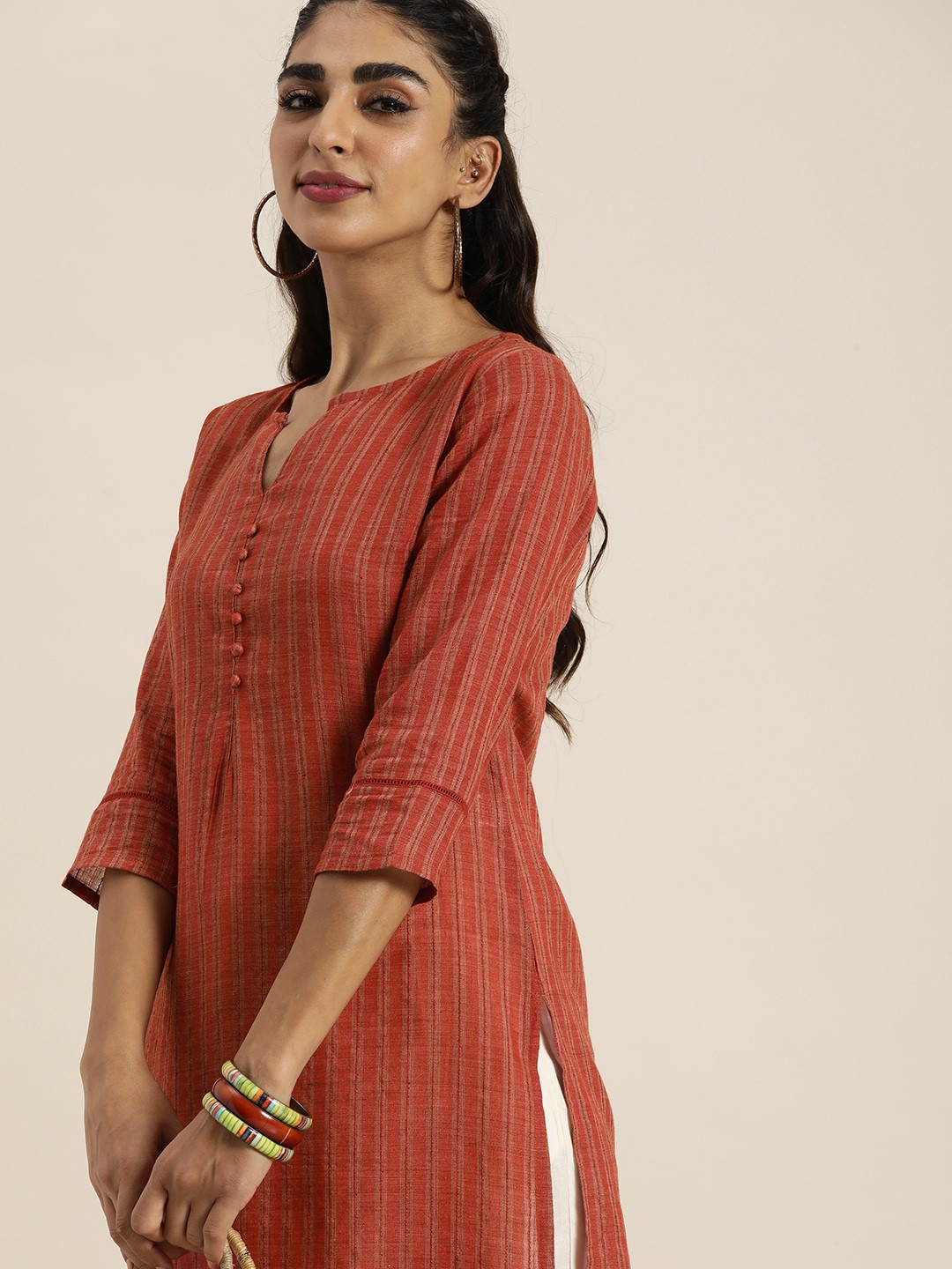 

Taavi Women Rust Striped Woven Legacy Kurta