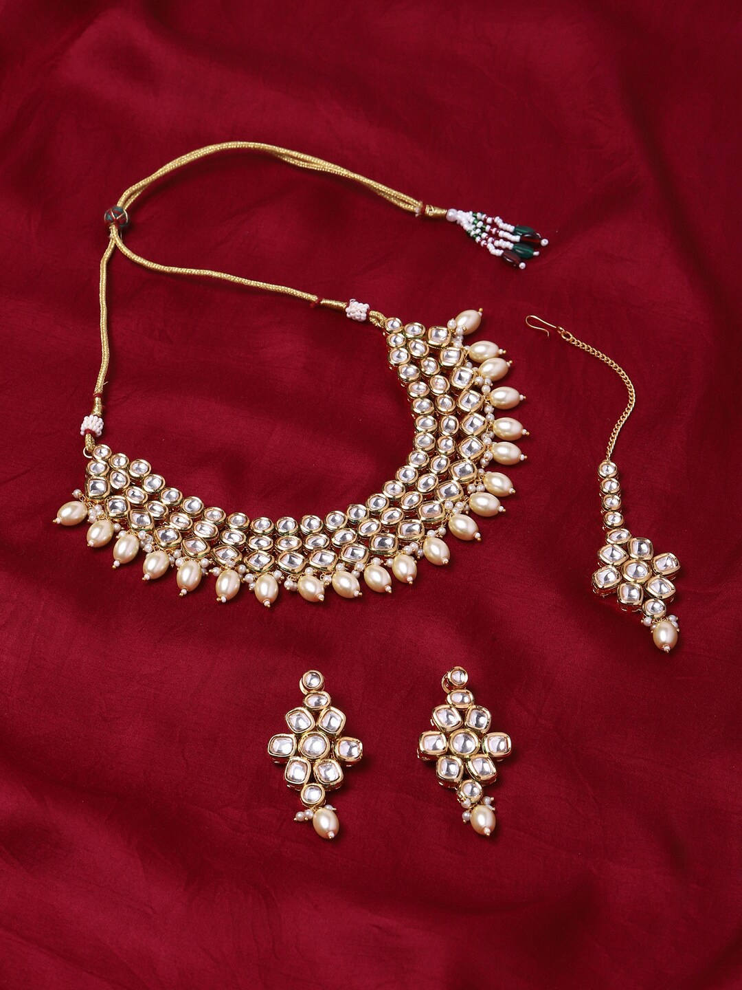 

Voylla Gold plated & White Kundan Brass Necklace Set