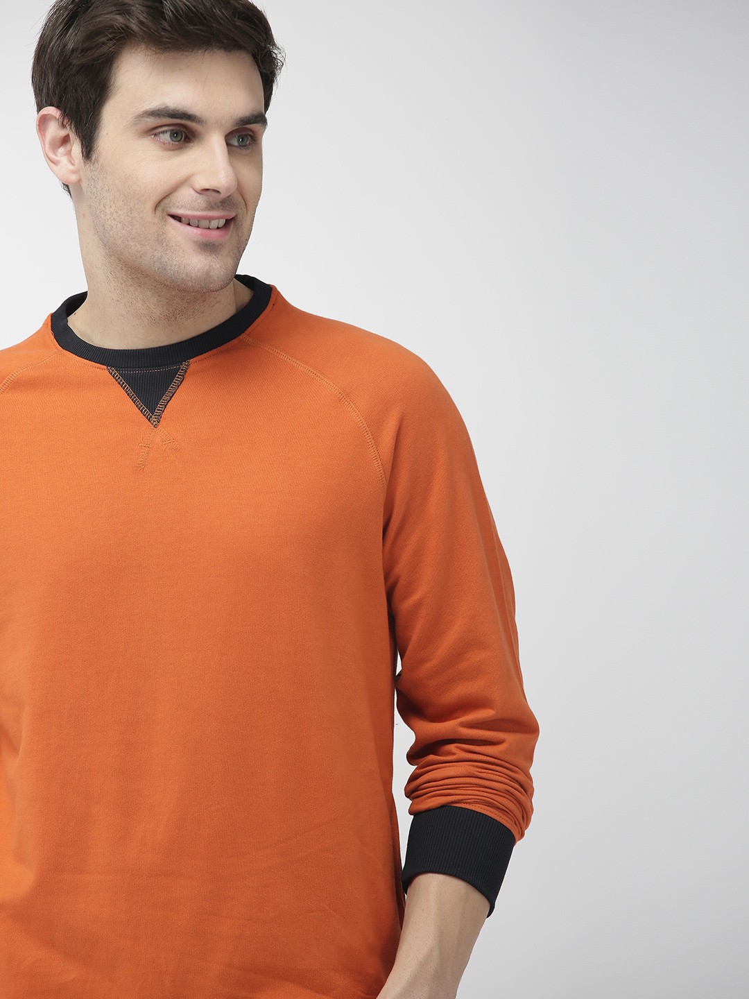 

Mast & Harbour Men Rust Orange Solid Pullover Sweatshirt