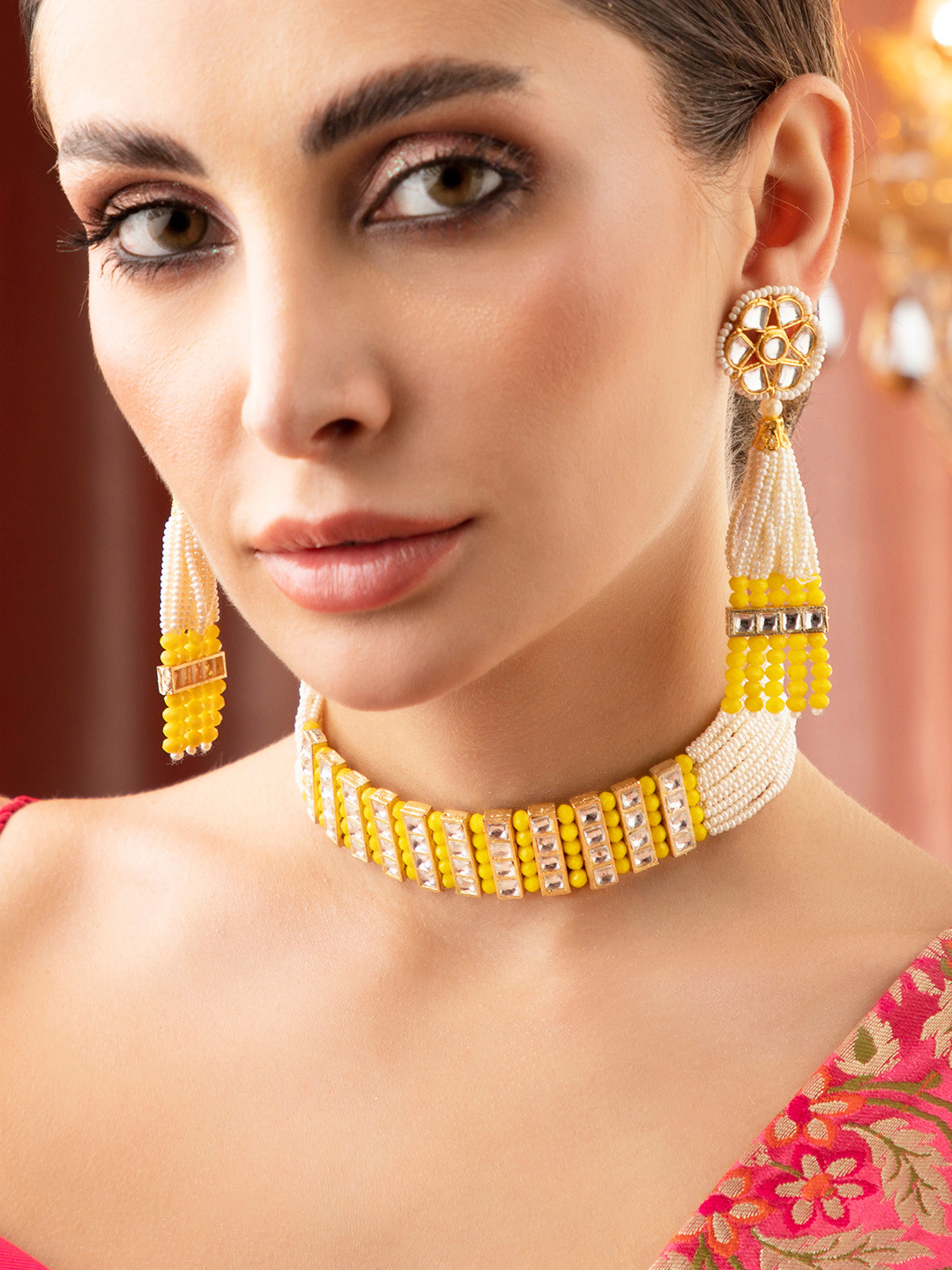 

Rubans Women Gold Plated Yellow & White Kundan-Studded & Beaded Jewellery Set