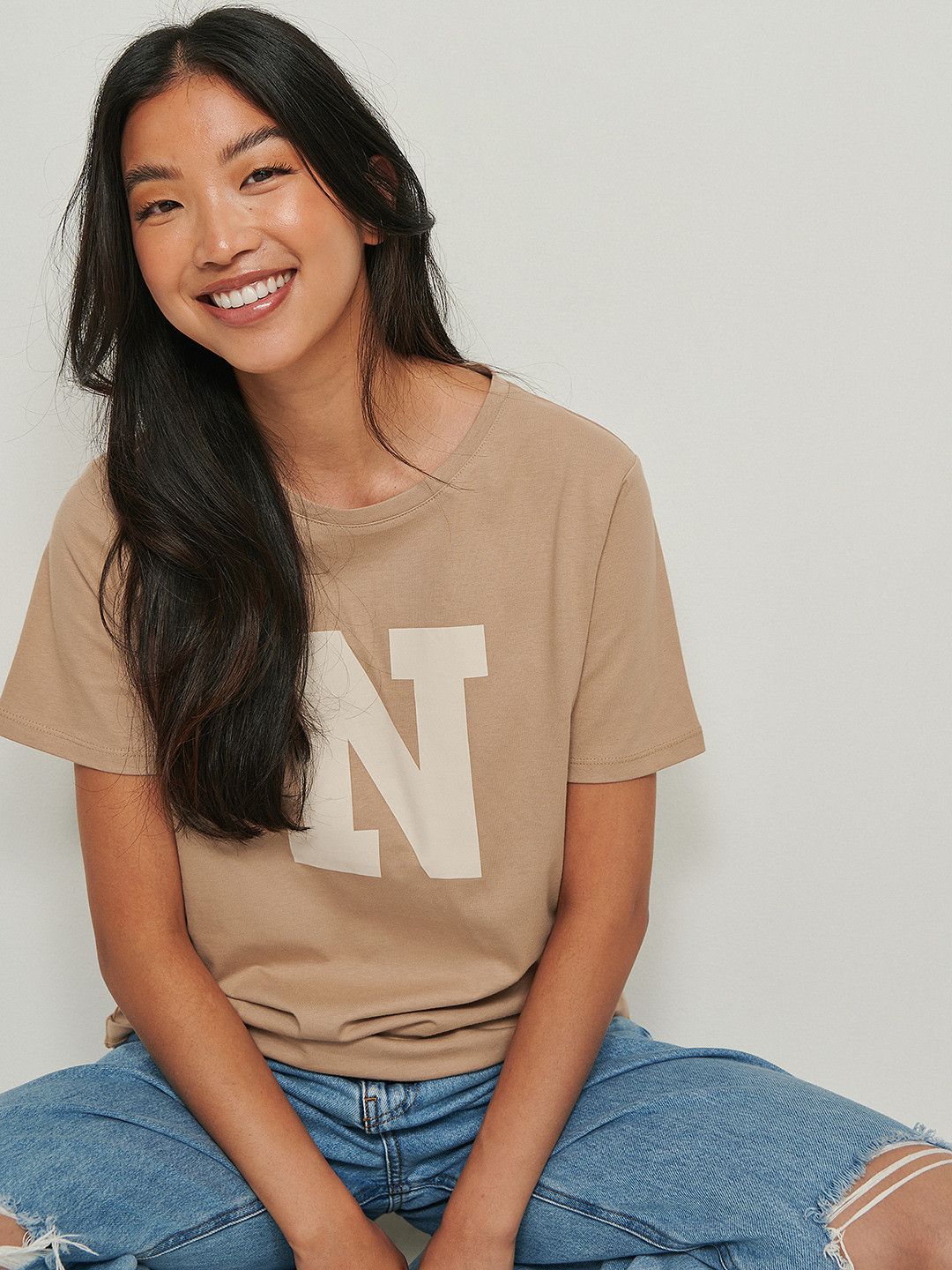 

NA-KD Women Beige Typography Printed Pure Cotton T-shirt