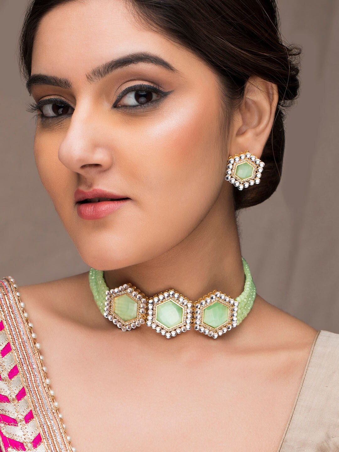 

Anouk Gold-Plated Mint Green Kundan Stone Studded Jewellery Set