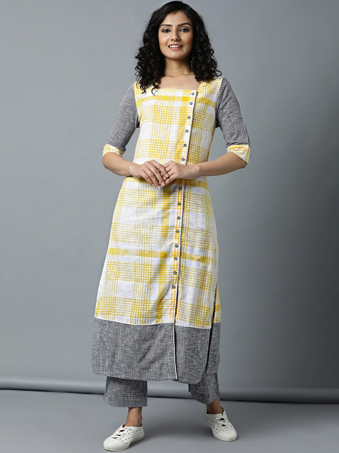 

Indian Dobby Women Yellow Checked Mirror Work Pastels Dobby Handloom Kurta