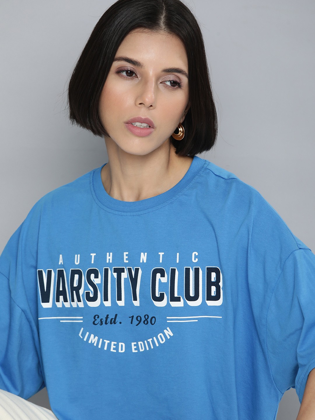 

Flying Machine Women Blue & Black Typography Printed Drop-Shoulder Sleeves Applique Boxy T-shirt