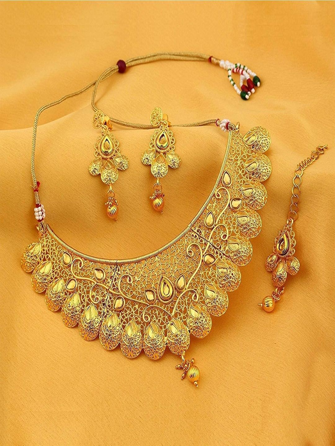 

Efulgenz Gold-Plated Crystal Studded Necklace Jewellery Set