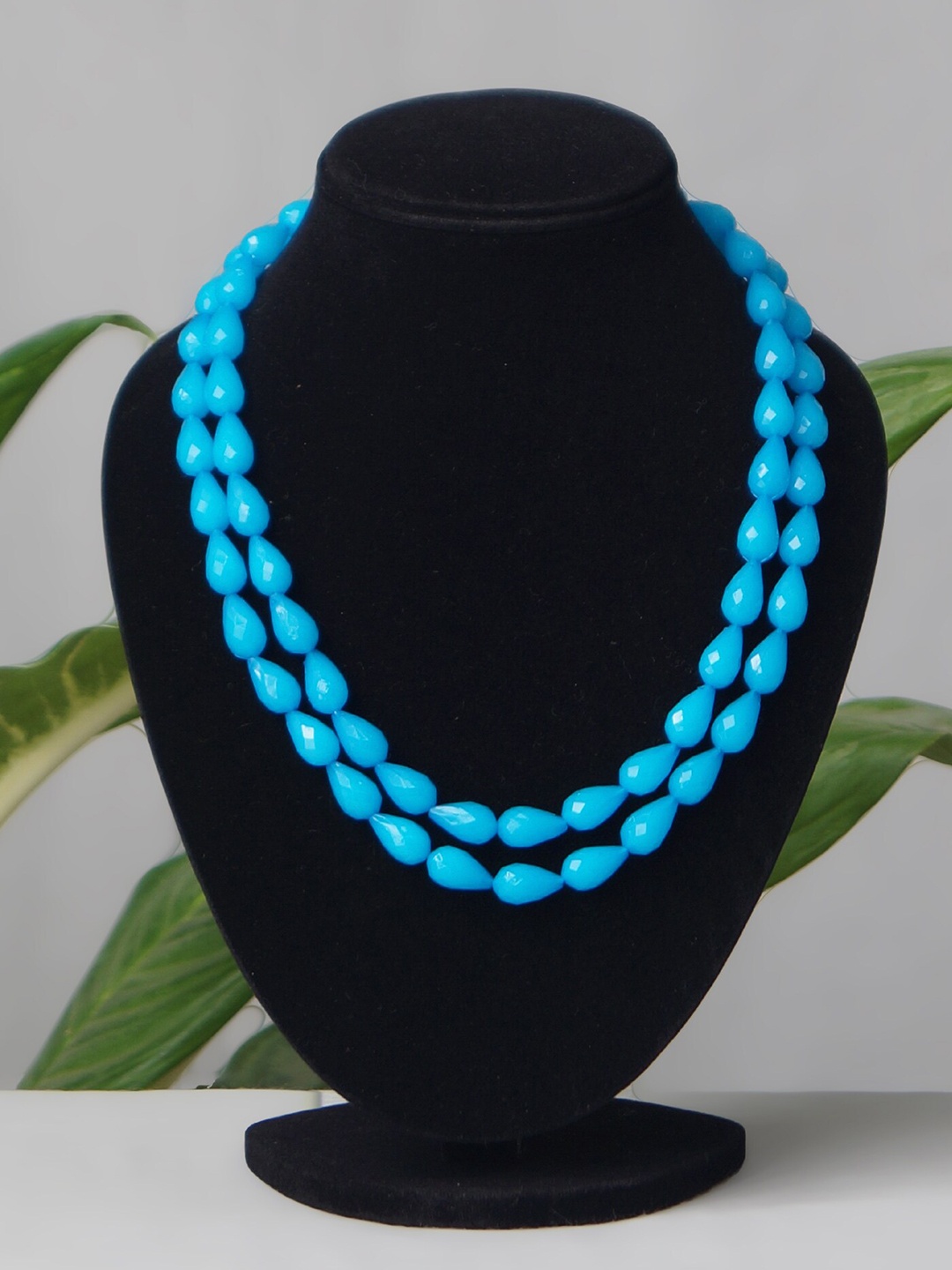 

Unnati Silks Blue Layered Long Oval Shape Beaded Necklace