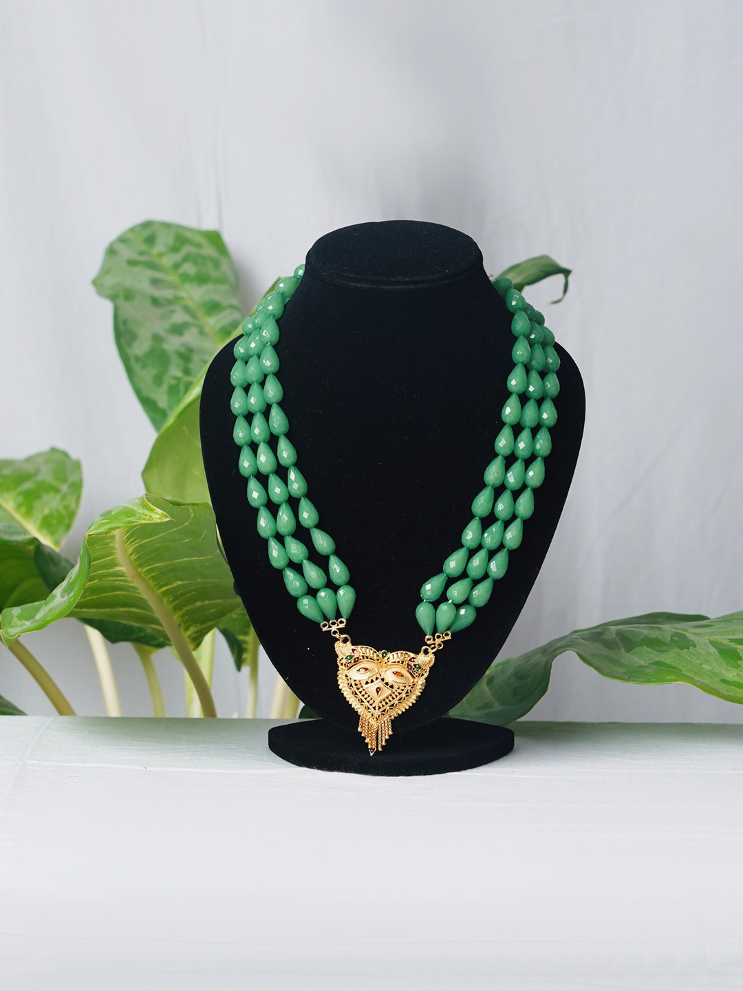 

Unnati Silks Green & Gold-Toned Beaded Layered Necklace