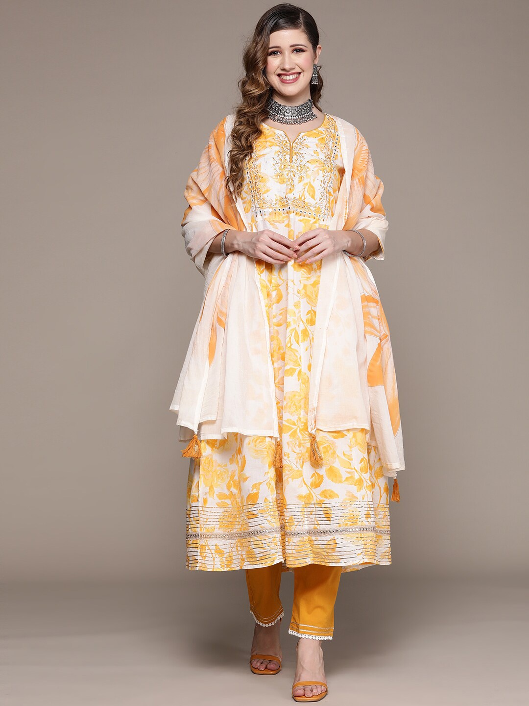 

Ishin Women Yellow Floral Printed Empire Thread Work Pure Cotton Kurta with Trousers & With Dupatta