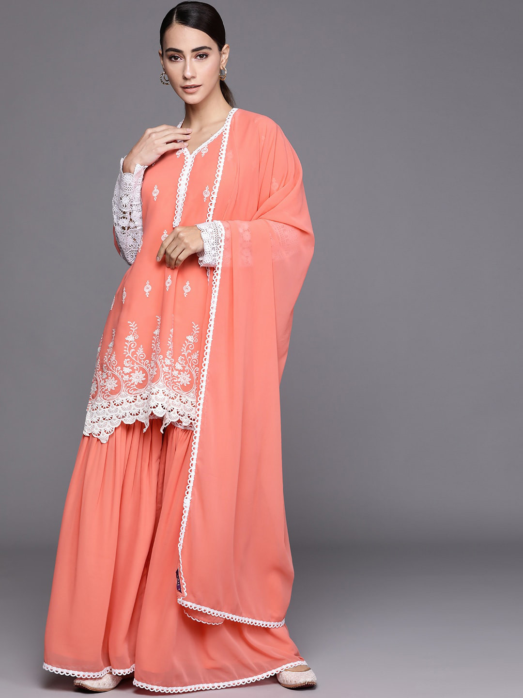 

Libas Women Peach-Coloured Floral Embroidered Cut Work Kurta with Sharara & With Dupatta