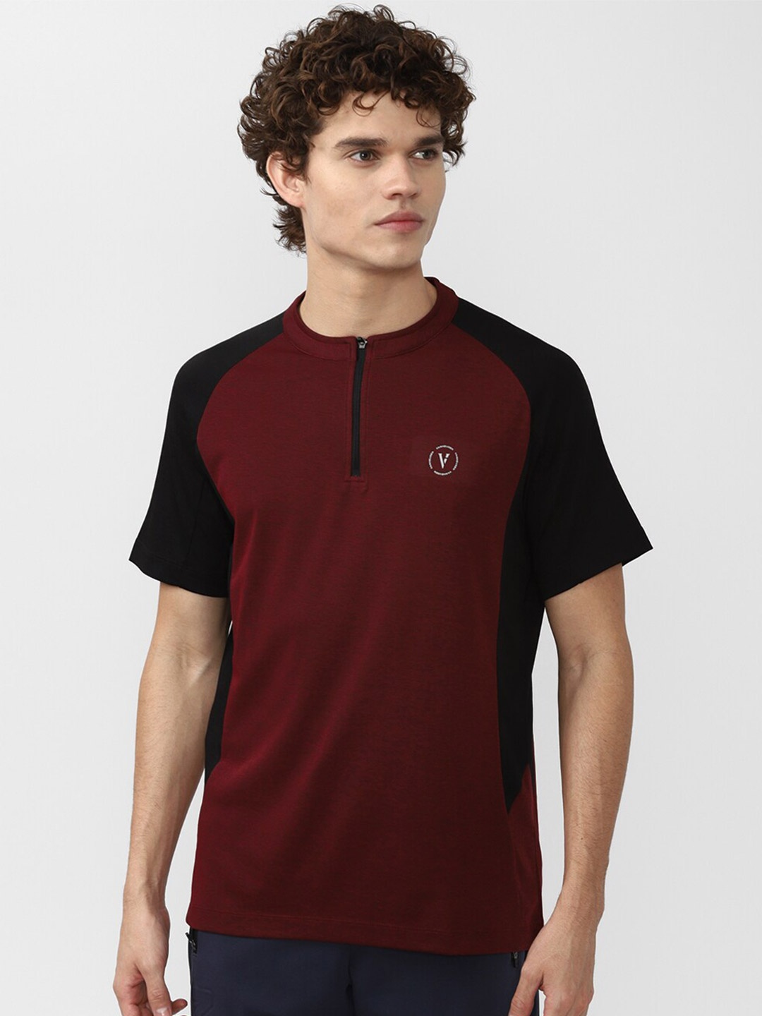 

Van Heusen Flex Men Colourblocked Henley Neck Slim Fit Golf T-shirt, Maroon