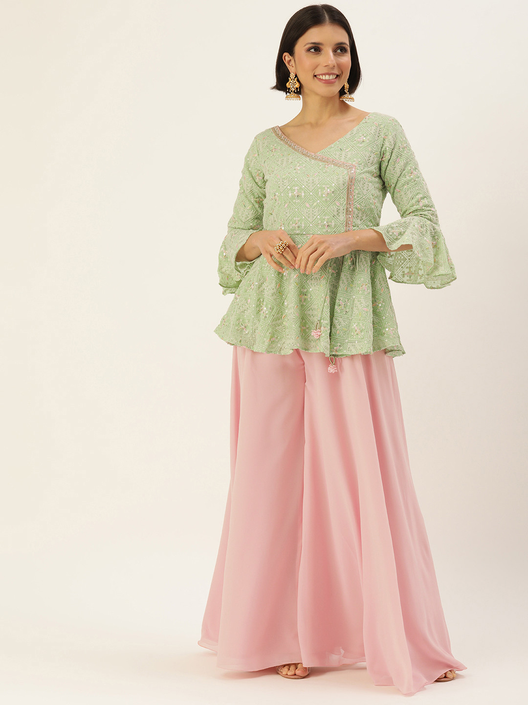 

Ethnovog Women Green Ethnic Motifs Embroidered Angrakha Sequinned Kurti with Palazzos