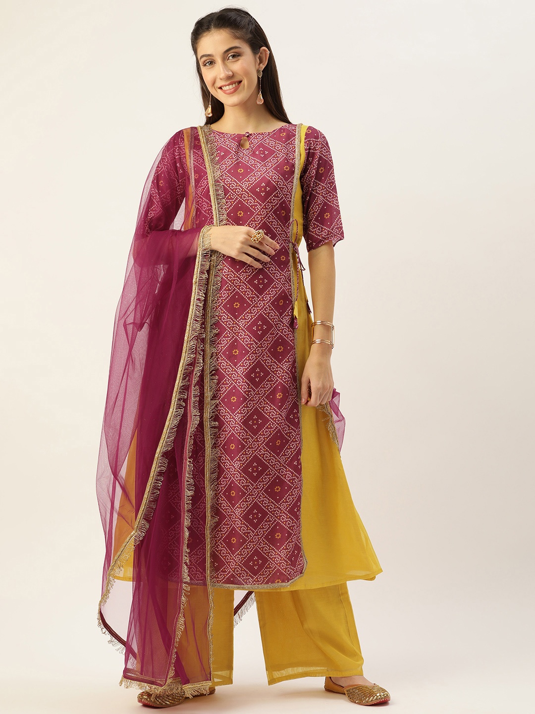 

Ethnovog Women Yellow Burgundy Bandhani Printed Kurta with Palazzos With Dupatta