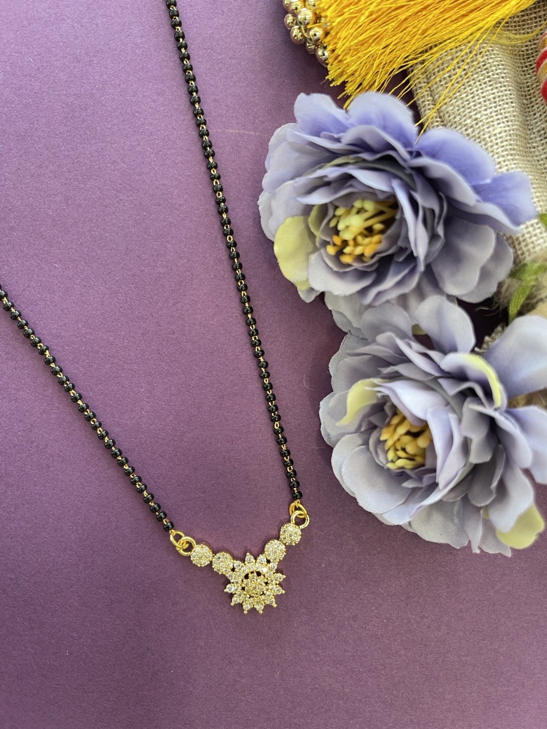 

Digital Dress Room Gold-Plated White AD-Studded & Black Beaded Mangalsutra