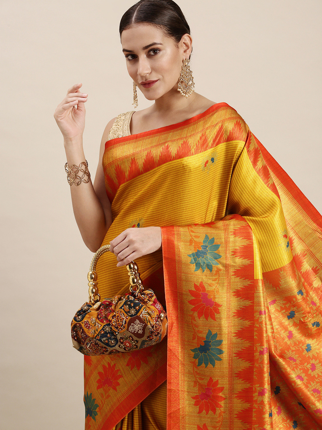 

Rudra Fashion Mustard Yellow & Orange Ethnic Motifs Silk Blend Saree